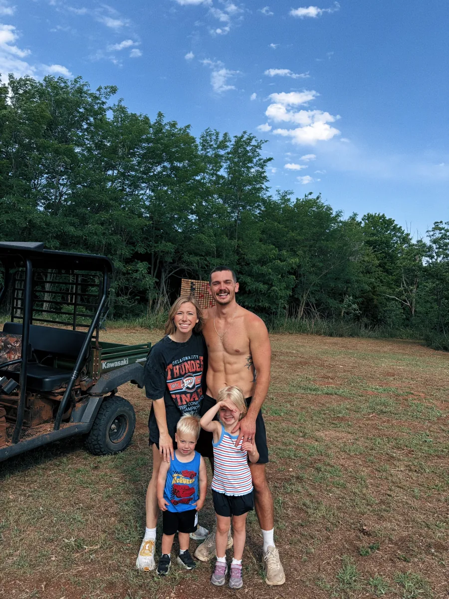 Timmy Riggs with his family outdoors